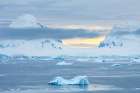 Antarctica. Icebergs and mountains at sunset. Art Print